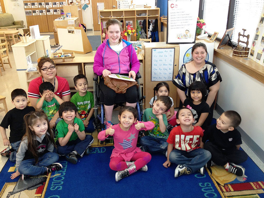 Intern Cantu Center reading to class